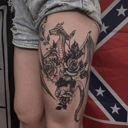 tatuaje de dragon en la pierna